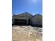 New construction home in progress showcasing the bare frame and stucco exterior with scaffolding at 1997 E Bucking Bronco Dr, San Tan Valley, AZ 85140