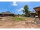 Huge backyard with a detached garage and an outdoor gazebo with seating at 2043 E Quartz St, Mesa, AZ 85213
