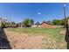 Large backyard features lush lawn space, gazebos, and a detached garage at 2043 E Quartz St, Mesa, AZ 85213