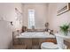 Bright bathroom features a tiled platform tub with a small window for natural light at 2043 E Quartz St, Mesa, AZ 85213