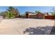 Sprawling estate featuring a grand entrance, stone accents, and an expansive driveway at 2043 E Quartz St, Mesa, AZ 85213