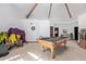 Spacious game room with pool table, high ceilings, and natural light at 2043 E Quartz St, Mesa, AZ 85213