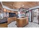 Stylish kitchen features dark countertops, wooden cabinets, and a wood ceiling at 2043 E Quartz St, Mesa, AZ 85213