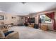 Spacious living room featuring neutral tones and a large window at 2043 E Quartz St, Mesa, AZ 85213