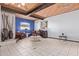 Bright living room boasts wood ceiling, tile flooring, and comfortable seating area at 2043 E Quartz St, Mesa, AZ 85213