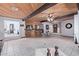 Expansive living room with wood ceiling, tile floors, bar, and open layout at 2043 E Quartz St, Mesa, AZ 85213