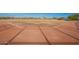 A well-maintained baseball field is perfectly lined and ready for a game, set against a clear sky at 22322 N 77Th St, Scottsdale, AZ 85255