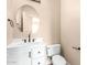 Stylish powder room features a modern vanity and round decorative mirror at 22322 N 77Th St, Scottsdale, AZ 85255