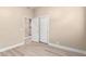 A bedroom featuring a closet, warm paint colors, and neutral plank flooring at 22322 N 77Th St, Scottsdale, AZ 85255