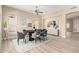Modern dining room boasts sleek black table, stylish gray chairs, and contemporary decor for elegant gatherings at 22322 N 77Th St, Scottsdale, AZ 85255