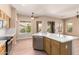 Open kitchen with stainless appliances, stone counters and backyard view at 22322 N 77Th St, Scottsdale, AZ 85255