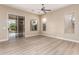 Spacious living room with sliding glass doors leading to a backyard pool area at 22322 N 77Th St, Scottsdale, AZ 85255
