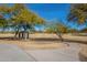 Scenic park path curving through trees with shaded seating area for residents at 22322 N 77Th St, Scottsdale, AZ 85255