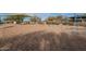 Swings and play structures in a sandy playground, offering fun for children in a sunny outdoor setting at 22322 N 77Th St, Scottsdale, AZ 85255