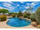 A backyard featuring a private pool and lush landscaping at 22322 N 77Th St, Scottsdale, AZ 85255