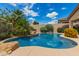 Beautiful pool surrounded by lush landscaping creating a private backyard oasis at 22322 N 77Th St, Scottsdale, AZ 85255
