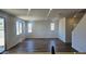 Bright living room with tile floors, large windows, and plenty of natural light at 22359 W Monona Ln, Surprise, AZ 85387