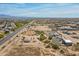 Scenic aerial view of homes and land with desert vegetation, offering a glimpse of the tranquil community surroundings at 22819 E Ray Rd, Mesa, AZ 85212