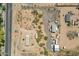 Bird's-eye perspective of land with a home and outbuildings, showing the property's setup and the open desert environment at 22819 E Ray Rd, Mesa, AZ 85212