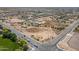 Expansive aerial view of a plot of land in a quiet community with nearby roads and scattered desert vegetation at 22819 E Ray Rd, Mesa, AZ 85212