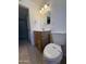 A bathroom shot showing the vanity, sink, toilet, and door to the rest of the home at 2401 W Weldon Ave, Phoenix, AZ 85015