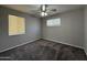 Bedroom featuring carpet, ceiling fan, and natural light from windows at 2401 W Weldon Ave, Phoenix, AZ 85015