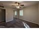 Bedroom showing the closet and windows for natural light, along with the ceiling fan at 2401 W Weldon Ave, Phoenix, AZ 85015