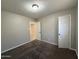 Bedroom featuring neutral walls, carpet, and access to additional rooms at 2401 W Weldon Ave, Phoenix, AZ 85015