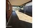 View of the carport, showcasing its covered parking area and access to the property at 2401 W Weldon Ave, Phoenix, AZ 85015