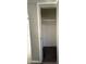 This is an empty closet with carpeting on the floor and a single shelf above at 2401 W Weldon Ave, Phoenix, AZ 85015
