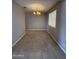 Cozy dining room with neutral walls, tile floors, and a classic chandelier fixture at 2401 W Weldon Ave, Phoenix, AZ 85015