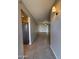 Hallway showing neutral paint, tile flooring, and decorative lighting fixtures at 2401 W Weldon Ave, Phoenix, AZ 85015
