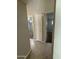 Hallway featuring tiled floors and access to bedrooms at 2401 W Weldon Ave, Phoenix, AZ 85015