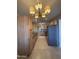 Well-equipped kitchen with stainless steel appliances and warm-toned wooden cabinetry at 2401 W Weldon Ave, Phoenix, AZ 85015