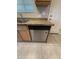 Close-up of the kitchen sink, granite countertops, wood cabinets, and stainless steel dishwasher at 2401 W Weldon Ave, Phoenix, AZ 85015
