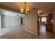 Open layout from living room to dining room and kitchen features continuous tile flooring at 2401 W Weldon Ave, Phoenix, AZ 85015