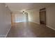 Bright living room featuring tile floors, a ceiling fan, and sliding glass doors at 2401 W Weldon Ave, Phoenix, AZ 85015