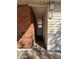 Side entrance with brick and vinyl siding, showing a passageway to the backyard at 2401 W Weldon Ave, Phoenix, AZ 85015