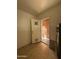 View of a utility room with access to the outside and a hot water heater unit at 2401 W Weldon Ave, Phoenix, AZ 85015