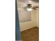 Bedroom with wood-look tile flooring and a ceiling fan at 2569 W Berridge Ln # D-115, Phoenix, AZ 85017