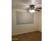 Bedroom with wood-look tile flooring and a ceiling fan at 2569 W Berridge Ln # D-115, Phoenix, AZ 85017