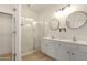 Bathroom with double sink vanity, walk-in glass shower, and modern fixtures at 28072 N Quartz Dr, San Tan Valley, AZ 85143