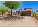Charming single-story home featuring a well-maintained yard, desert landscaping and a spacious two-car garage at 28072 N Quartz Dr, San Tan Valley, AZ 85143