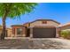 Charming single-story home featuring a well-maintained yard, desert landscaping and a spacious two-car garage at 28072 N Quartz Dr, San Tan Valley, AZ 85143