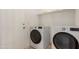 Modern laundry room equipped with a side-by-side washer and dryer at 28072 N Quartz Dr, San Tan Valley, AZ 85143