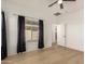 Spacious main bedroom features hardwood floors and large windows at 28072 N Quartz Dr, San Tan Valley, AZ 85143
