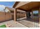 View of the covered back patio showing the house exterior and gravel landscaping at 28072 N Quartz Dr, San Tan Valley, AZ 85143