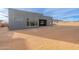 View of the modern home exterior, featuring large windows providing ample natural light and a spacious backyard at 28421 N 59Th Way, Cave Creek, AZ 85331