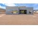Modern home exterior with ample windows offering natural light, set against a backdrop of a spacious backyard at 28421 N 59Th Way, Cave Creek, AZ 85331