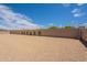 Large backyard featuring a decorative brick wall and minimalist landscaping, perfect for customization at 28421 N 59Th Way, Cave Creek, AZ 85331